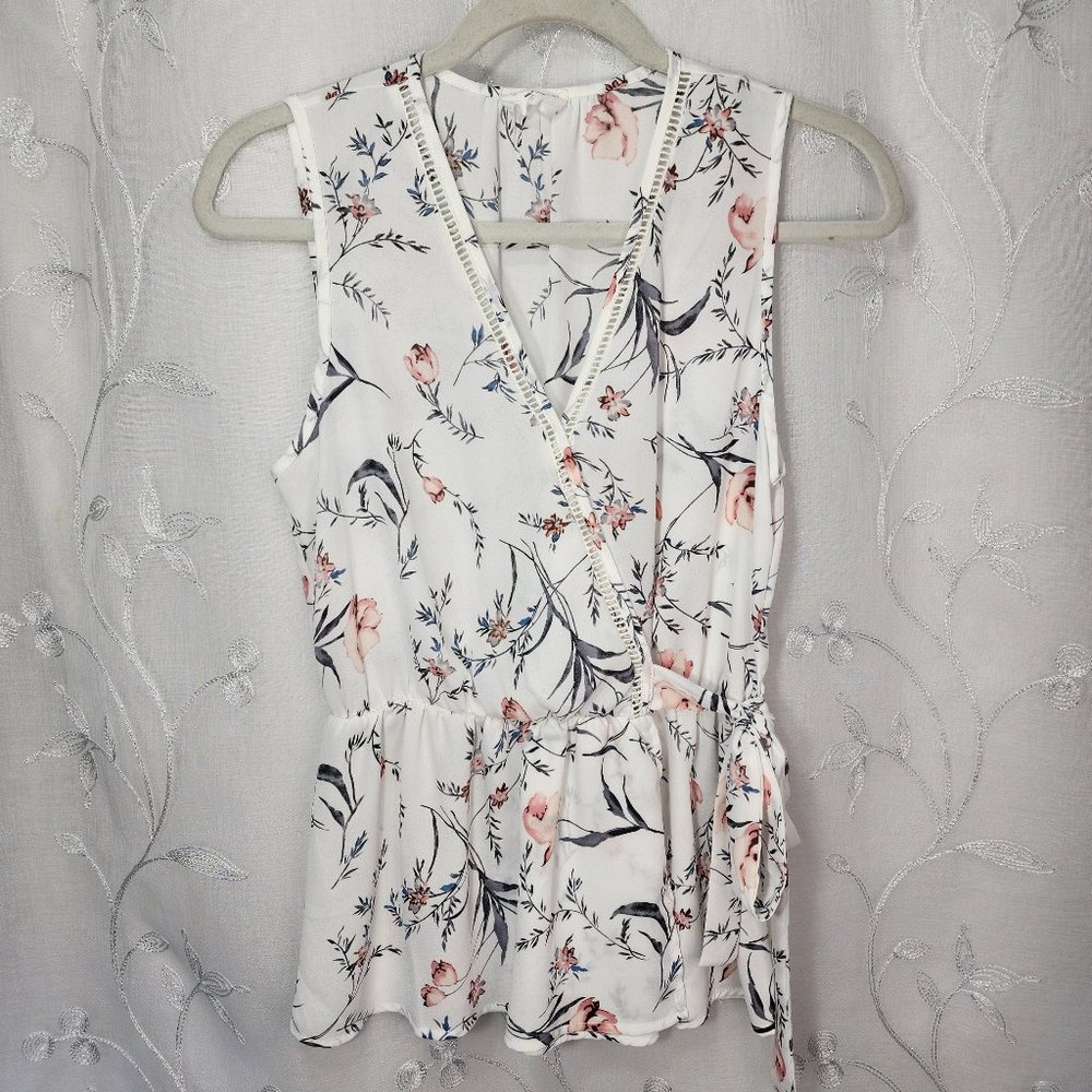 Sienna Sky Sleeveless, Faux-Wrap, V-neck Blouse.